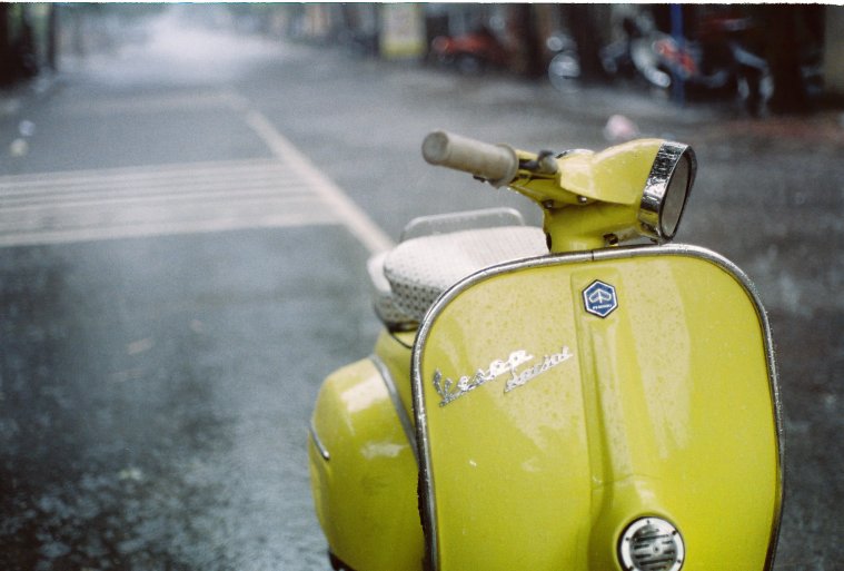 Yellow Vespa in the Rain by Khánh Hmoong 